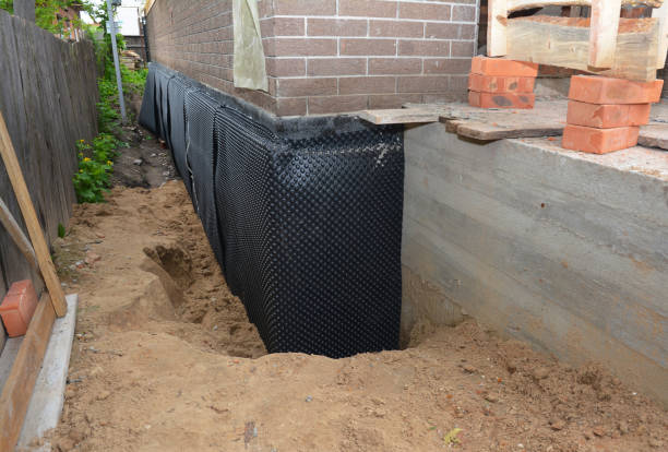 SJ Waterproofing Pros technician performing targeted Foundation Crack Repair assessment in Trimble, OH